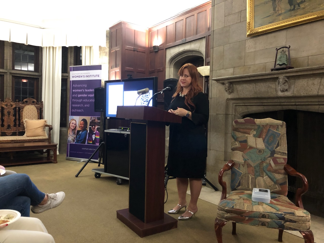 Jennie speaking at an academic event